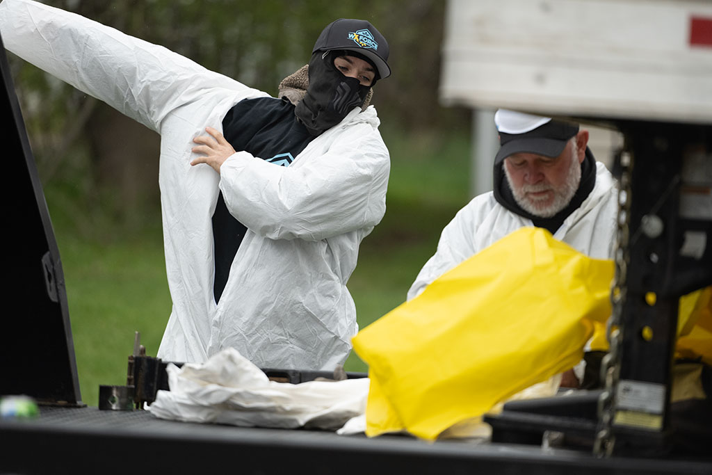 workers putting on protective gear