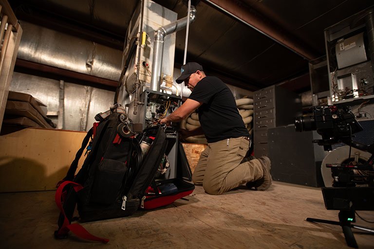 worker working on a furnace